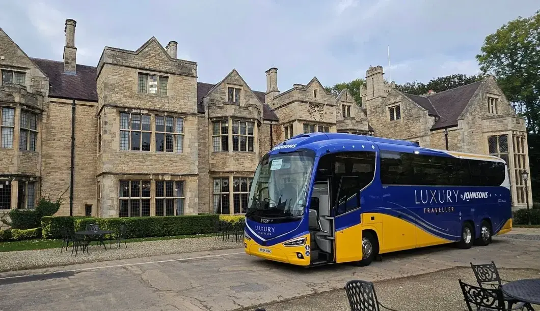 Luxury coach outside building