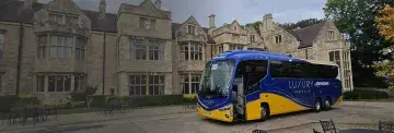 Luxury coach outside building